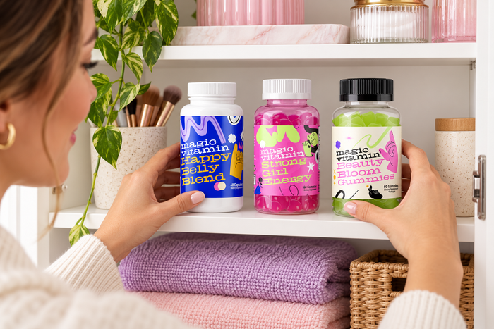Woman storing Happy Belly Blend, Strong Girl Energy and Beauty Bloom Gummies
