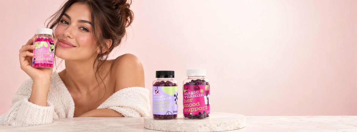 Smiling woman holding Magic Vitamin gummies